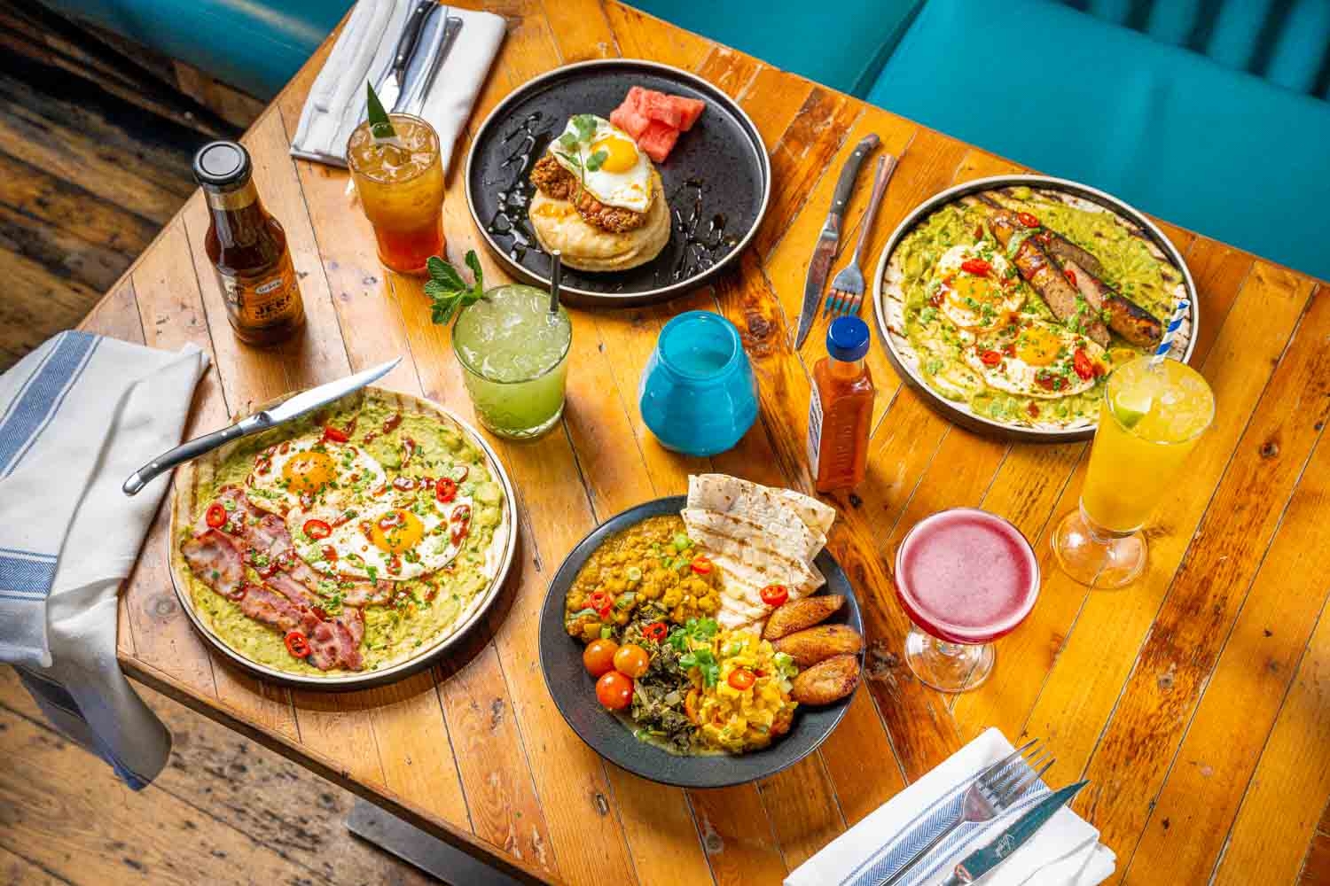 Brunch dishes on the table with tropical cocktails