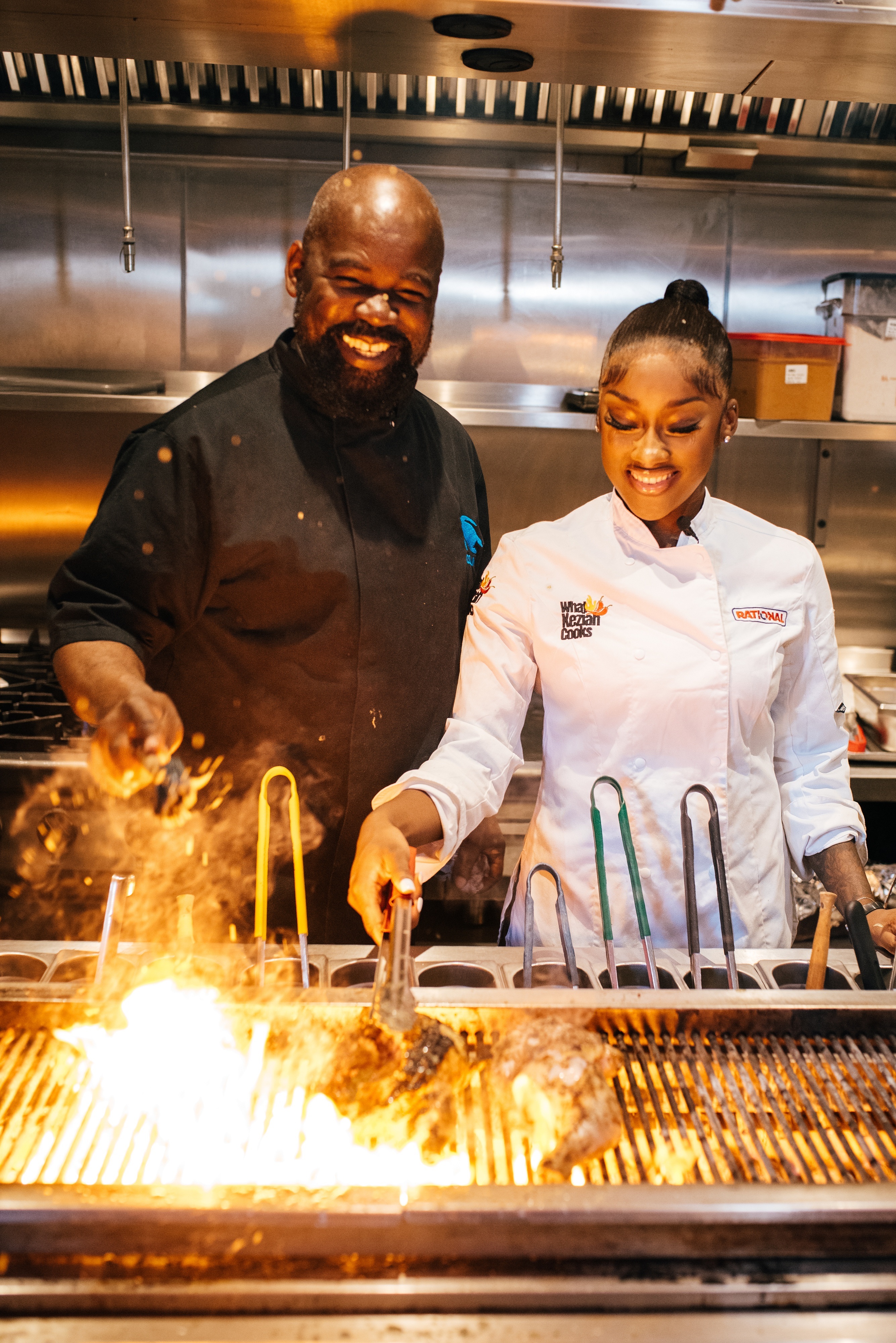 Chef Collin and Keziah on the jerk pit