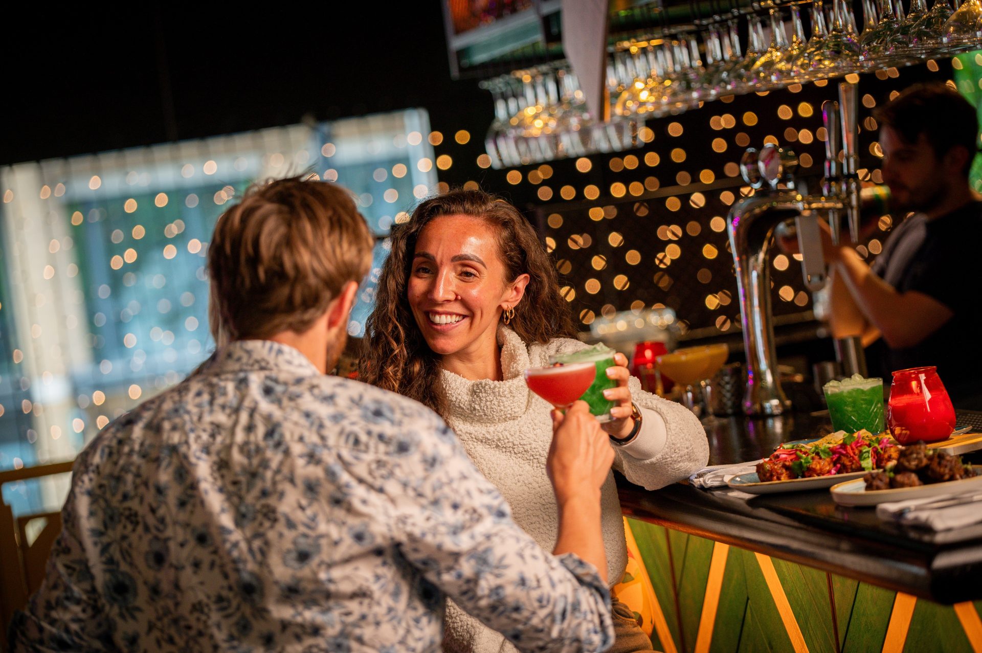 Couple at Bar Cocktail Cheers 1