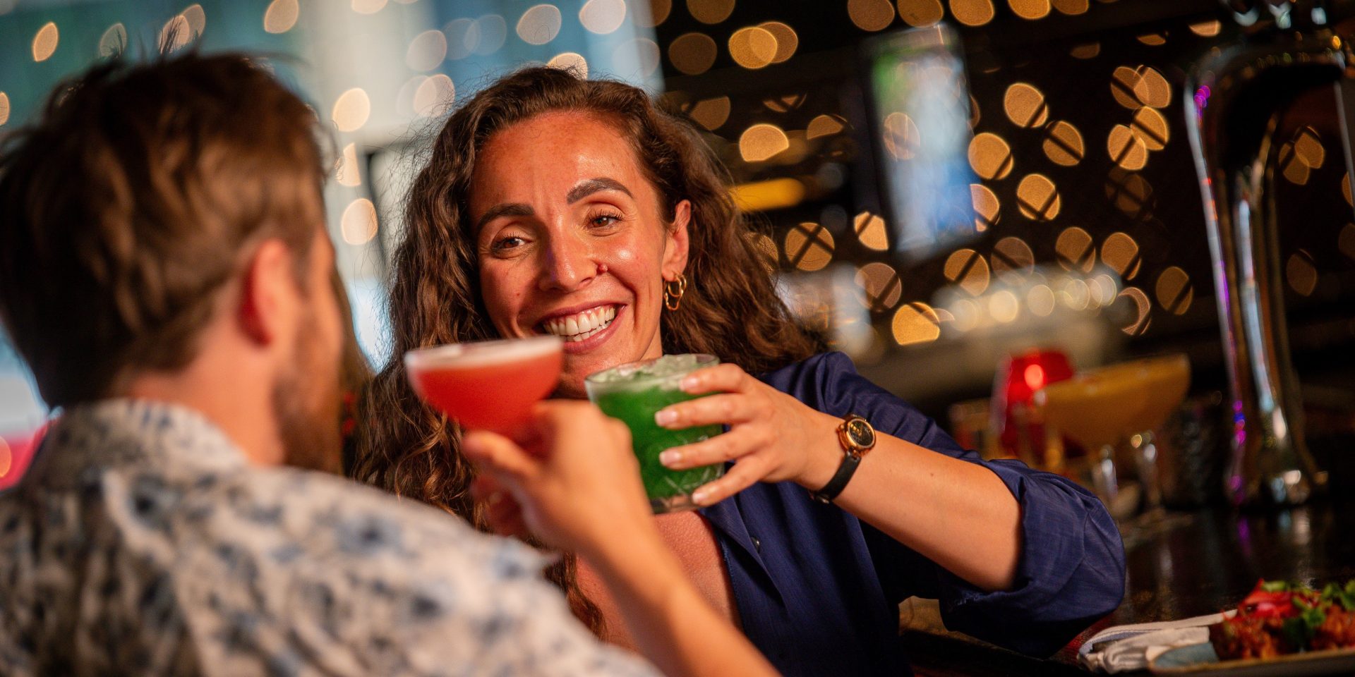 Couple at Bar with Food and Cocktails 31