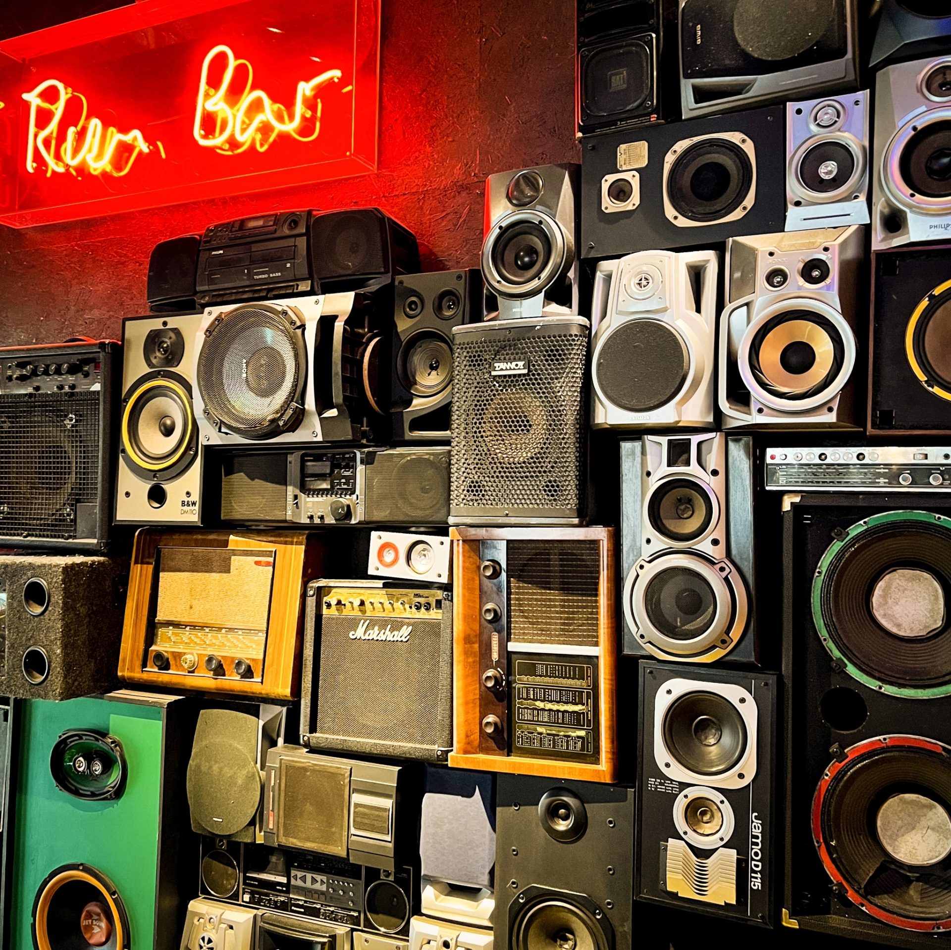 Turtle Bay interior speaker wall and rum bar neon sign