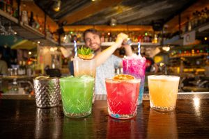 New tropical cocktails lined up on the island bar