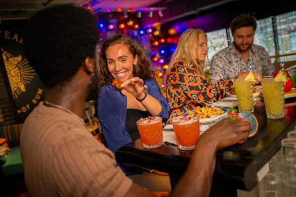 Couple at Bar Feeding Eachother 1