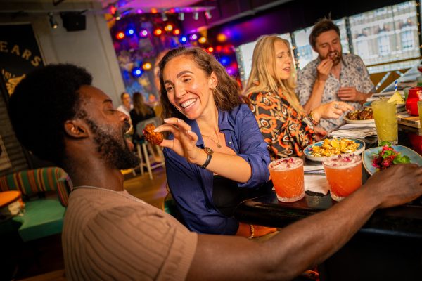 Couple at Bar Feeding Eachother 6