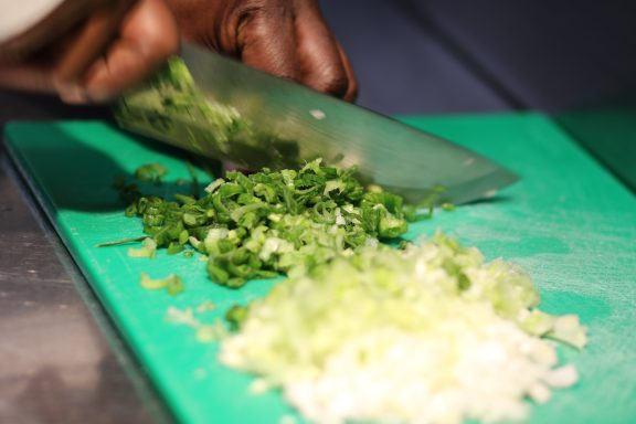 Chef Collin chopping ingredients