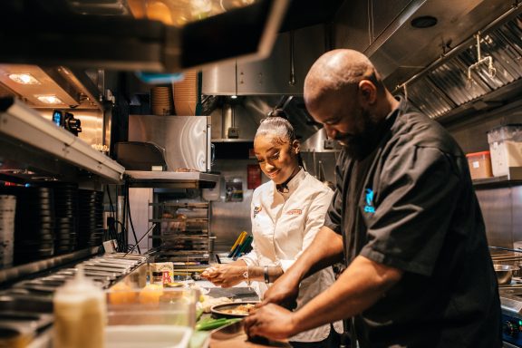 Chefs chopping ingredients