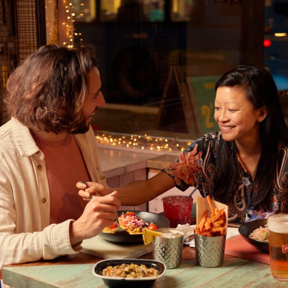 Couple enjoying dinner and drinks